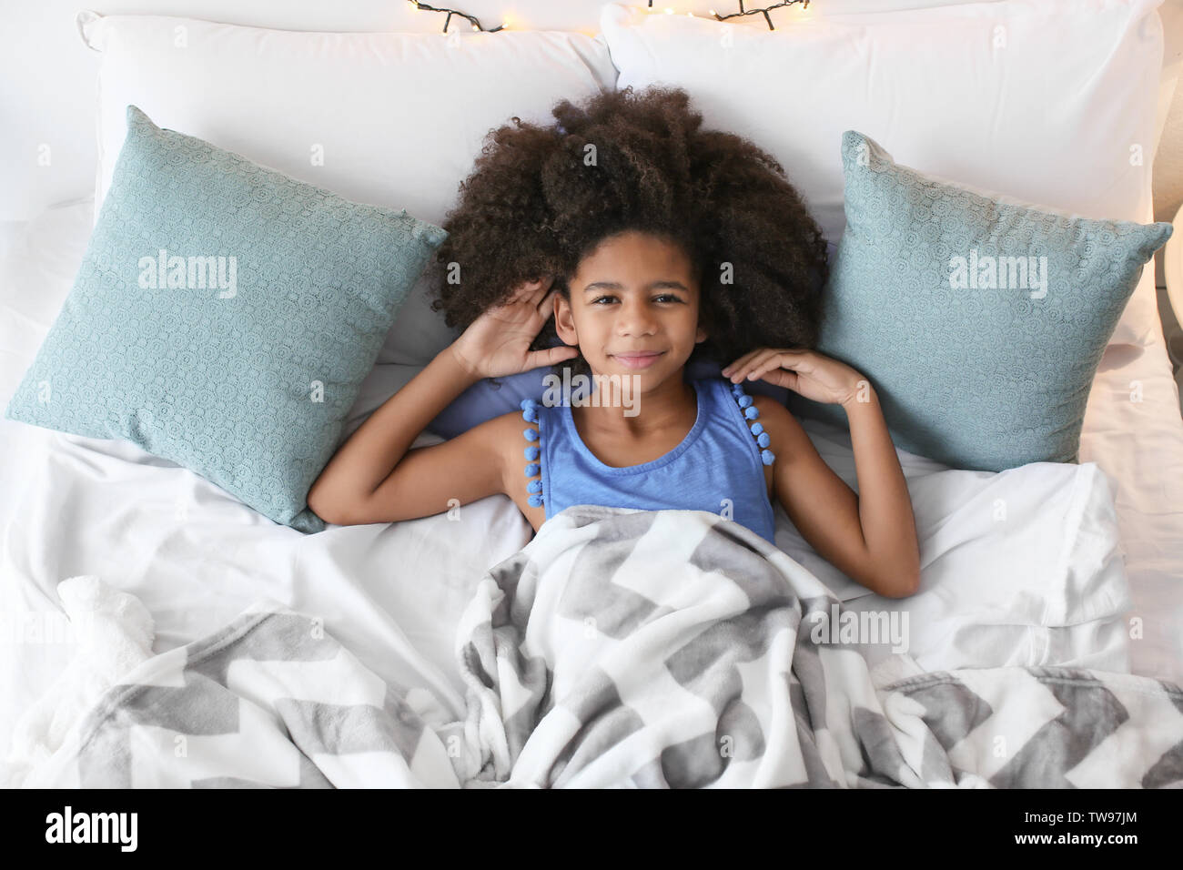 Cute African American girl in bed Stock Photo - Alamy