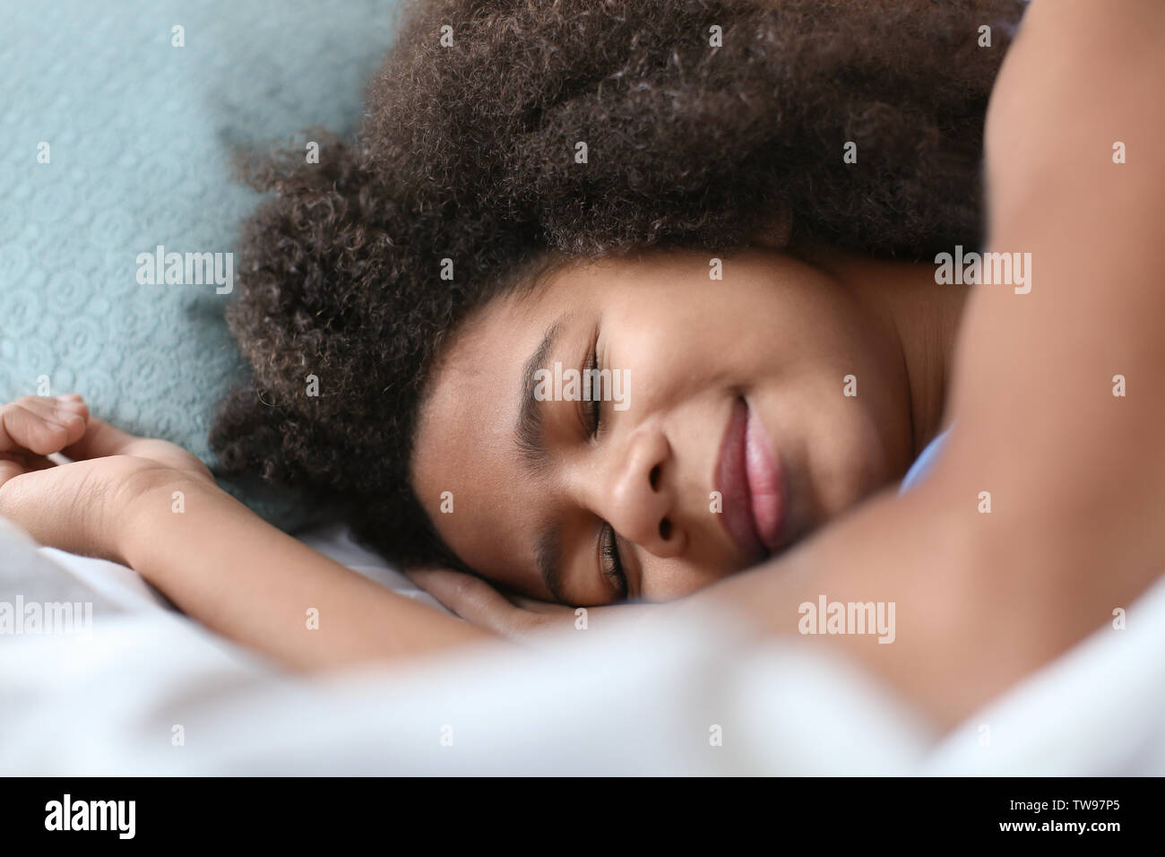 Cute African American girl sleeping in bed Stock Photo - Alamy