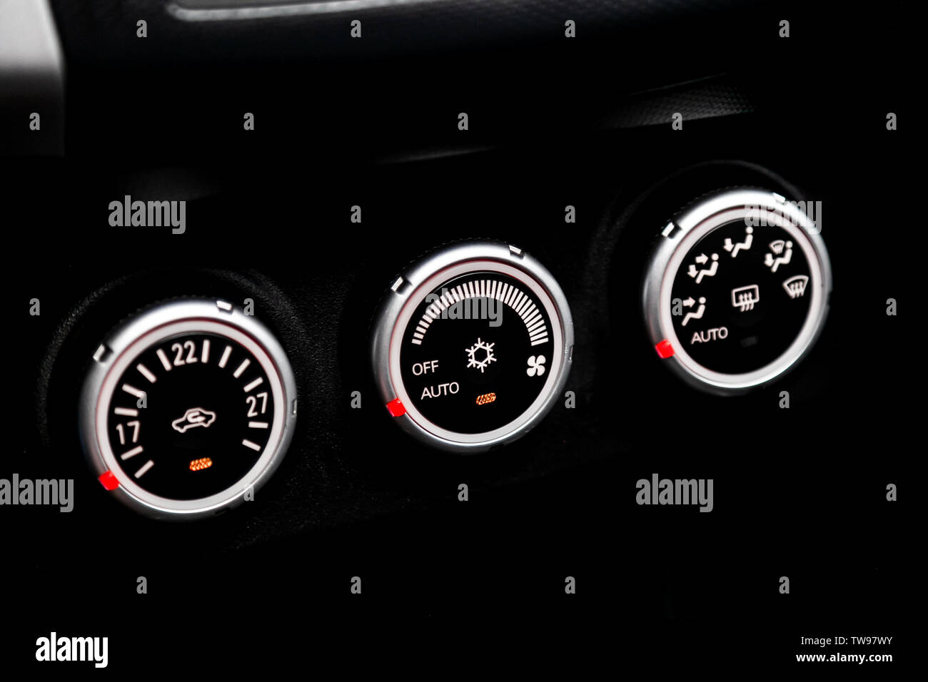 Black detail with the air conditioning button, inside a car. Close up car ventilation system and
