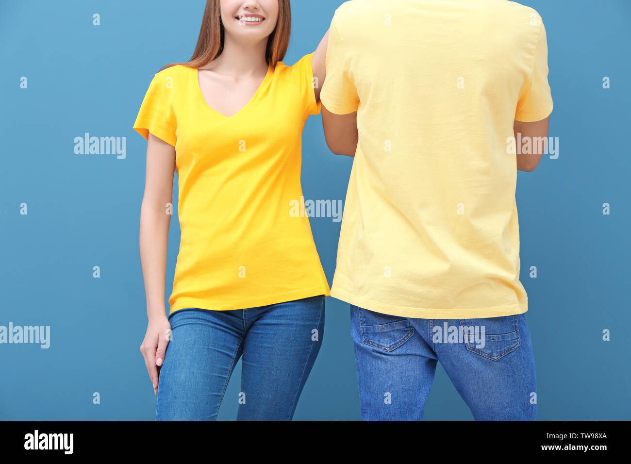 Download Young Woman And Man In Yellow T Shirts On Color Background Mockup For Design Stock Photo Alamy PSD Mockup Templates