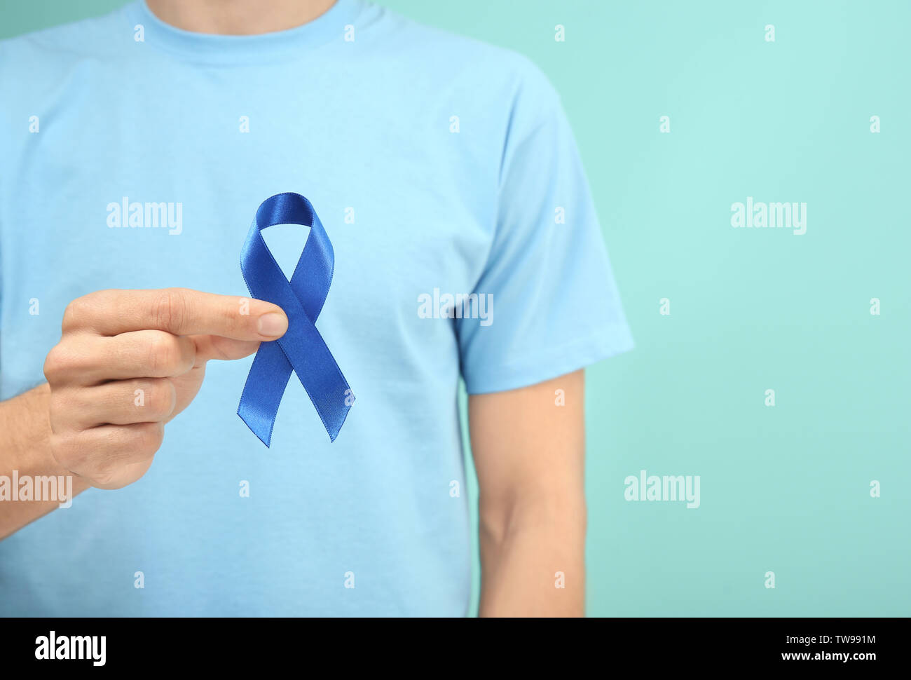 Man Holding Blue Ribbon On Color Background Closeup Prostate Cancer Awareness Stock Photo Alamy