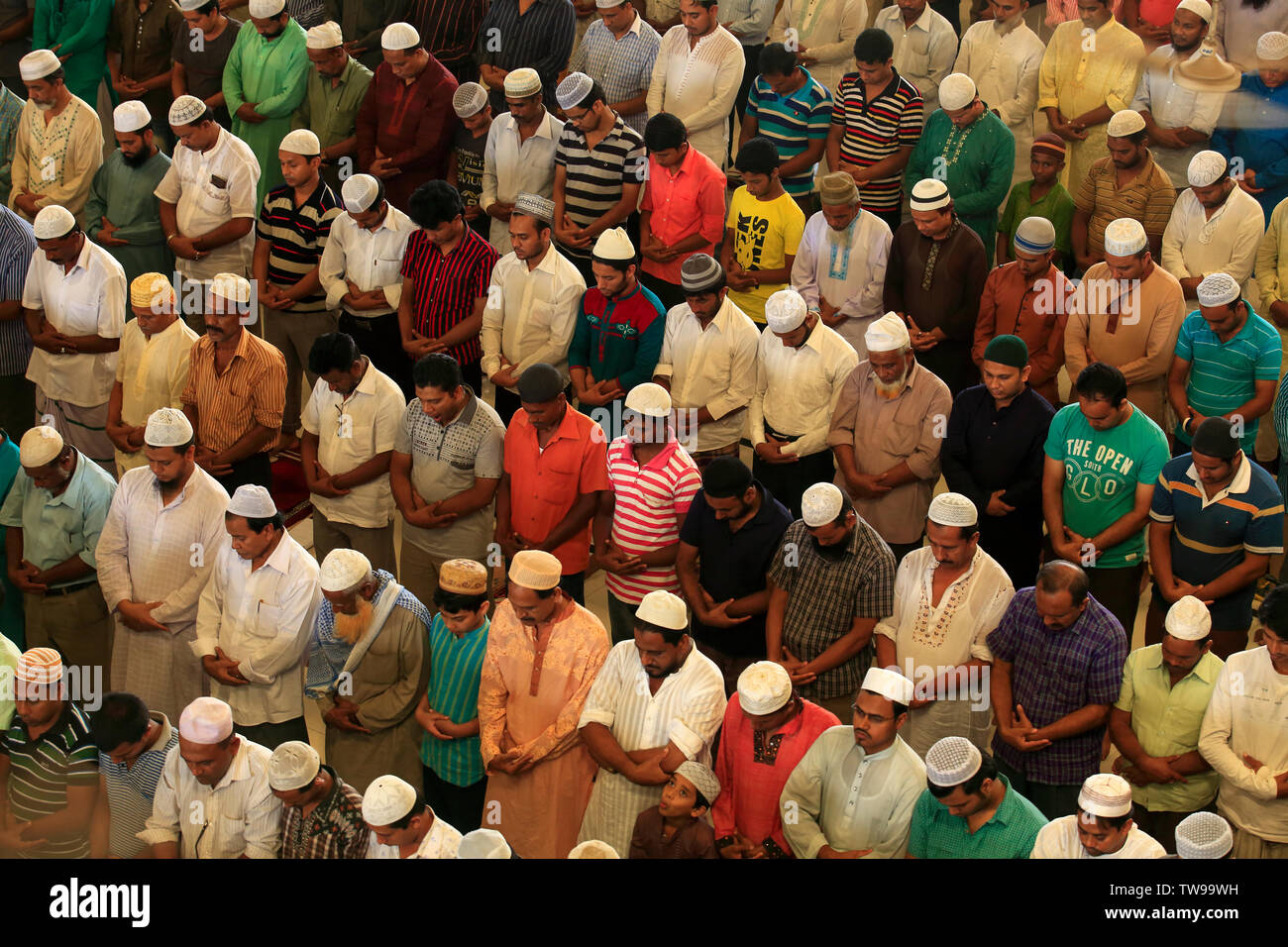 Muslims offer Eid–ul-Fitr prayers at the Baitul Mukarram National Mosque in Dhaka, Bangladesh. Stock Photo