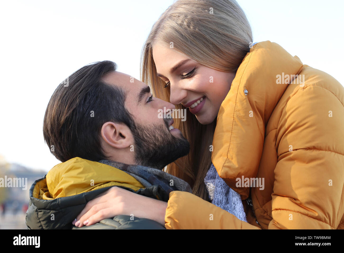 Young romantic couple hugging outdoors Stock Photo - Alamy