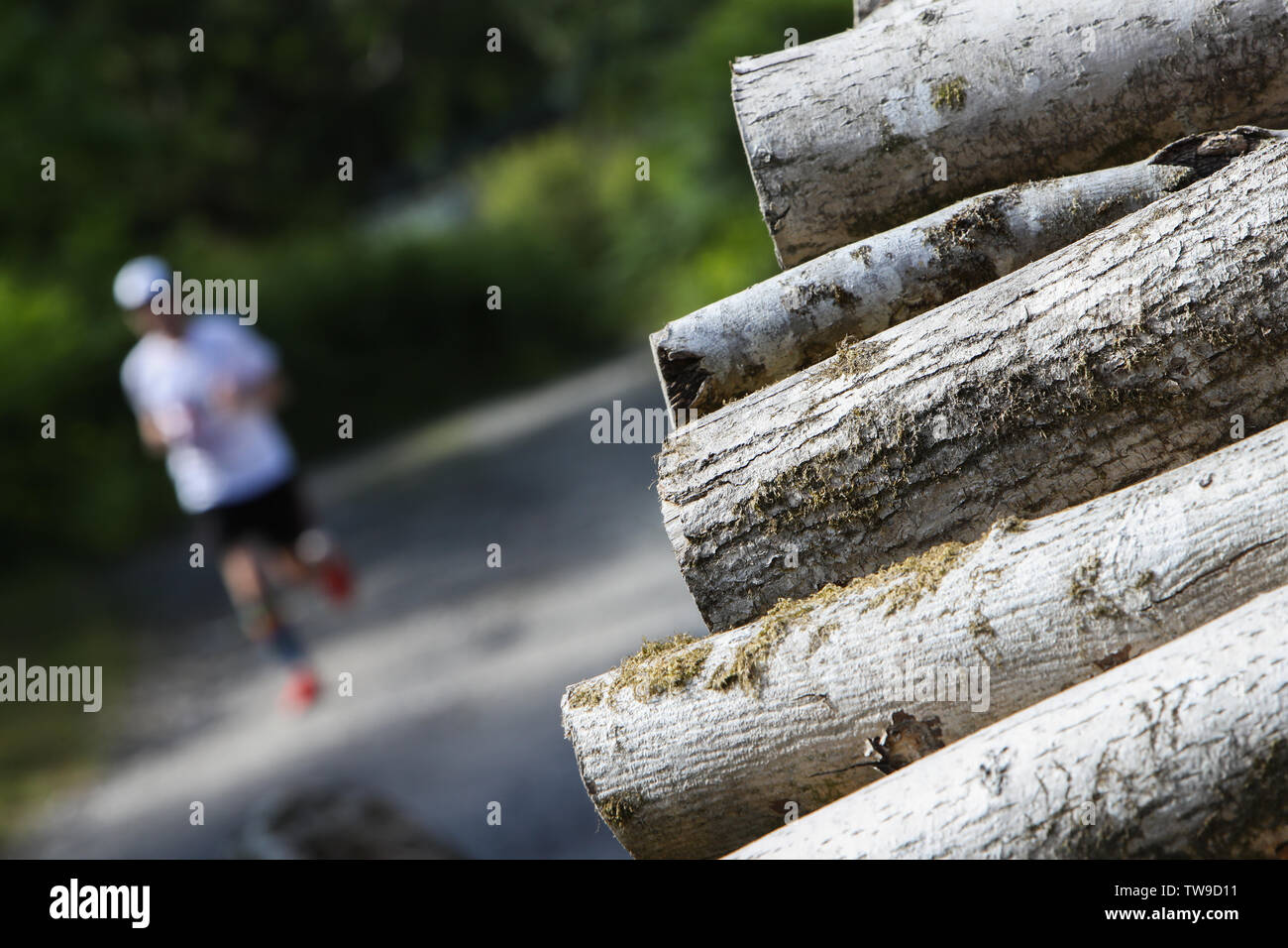 An Ultra Marathon runner negotiates the trails during a 24hr endurance event in the UK. Stock Photo