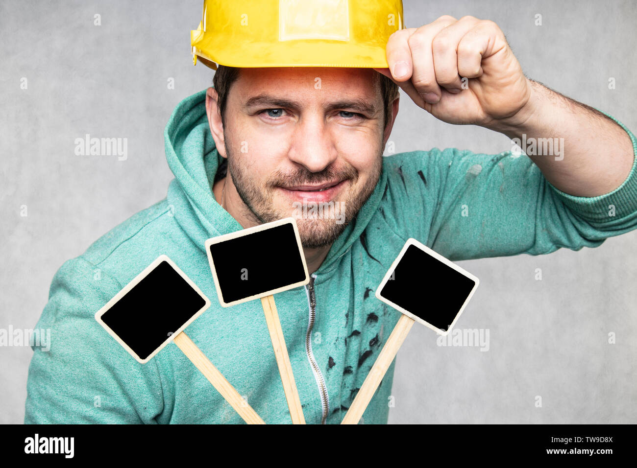 construction worker holding a blackboard with space for text or text, copy space Stock Photo