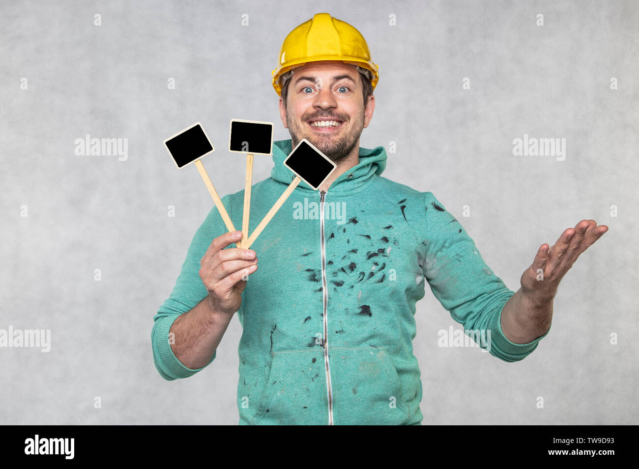 construction worker holding a blackboard with space for text or text, copy space Stock Photo