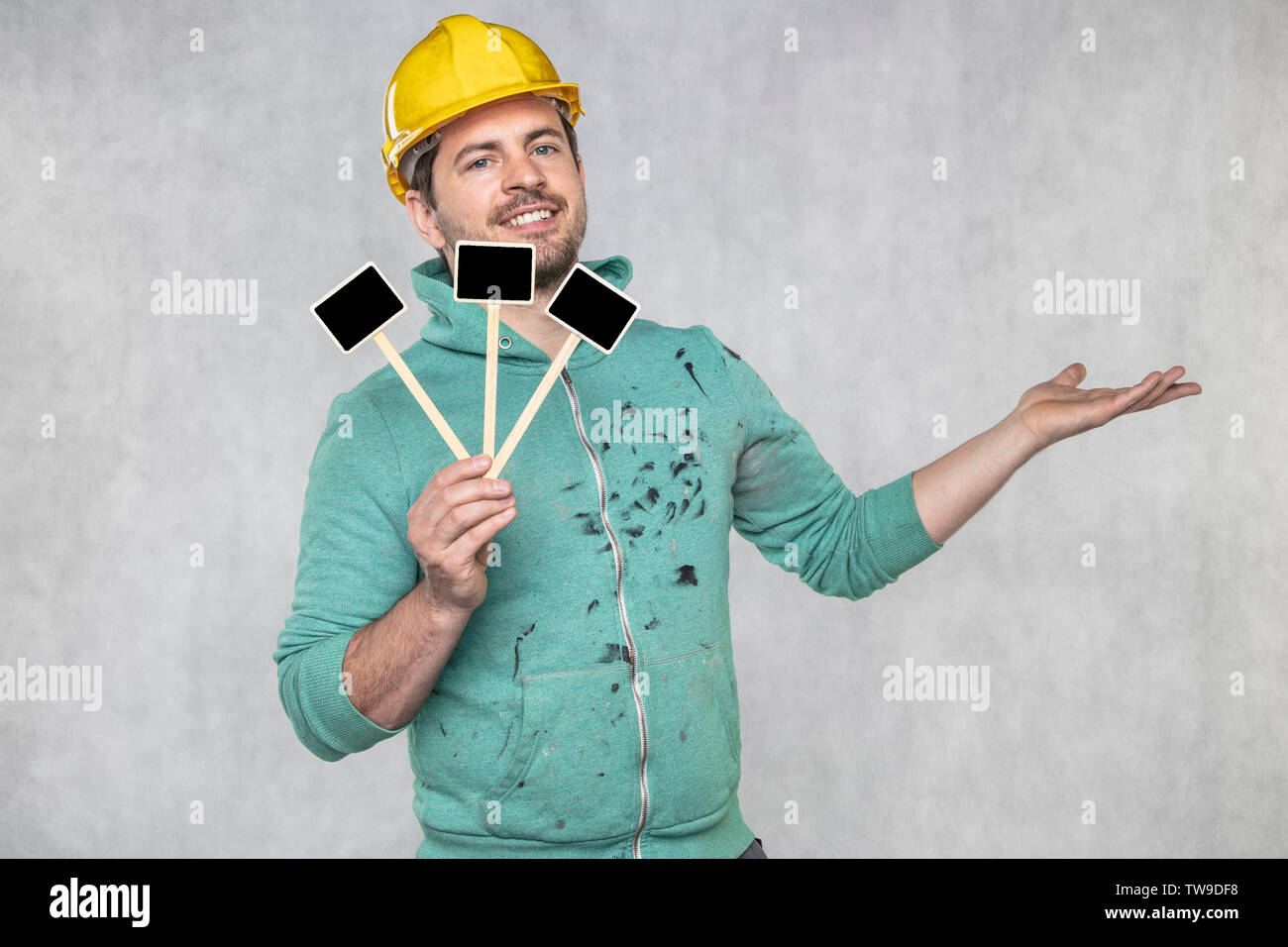 construction worker holding a blackboard with space for text or text, copy space Stock Photo