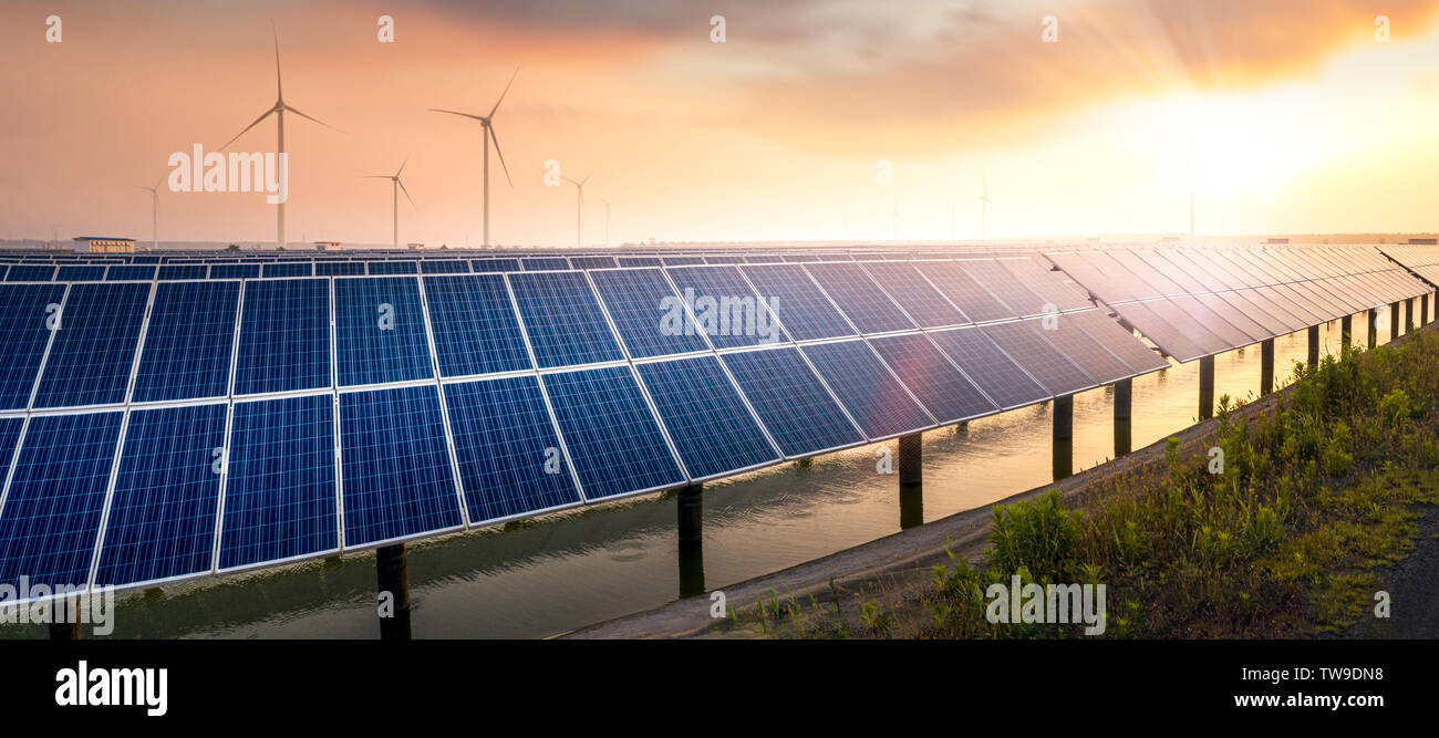 Sunset rays over a photovoltaic power plant Stock Photo