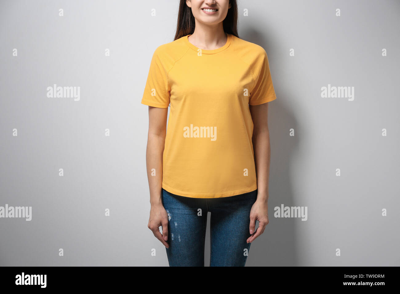 Download Woman In Yellow T Shirt On Light Background Mock Up For Design Stock Photo Alamy PSD Mockup Templates