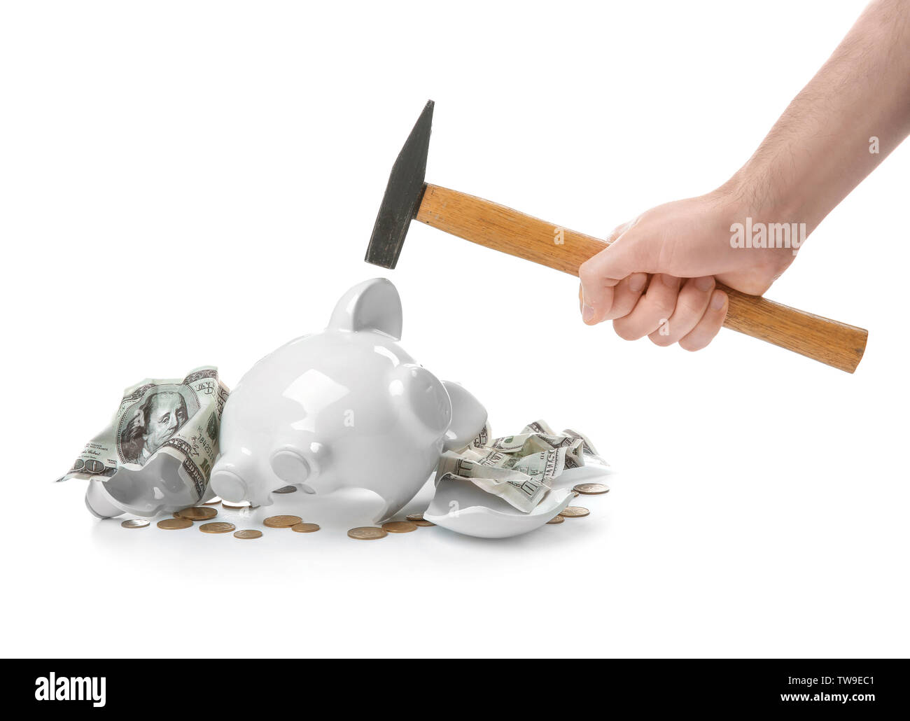 Man holding hammer over broken piggy bank on white background Stock ...