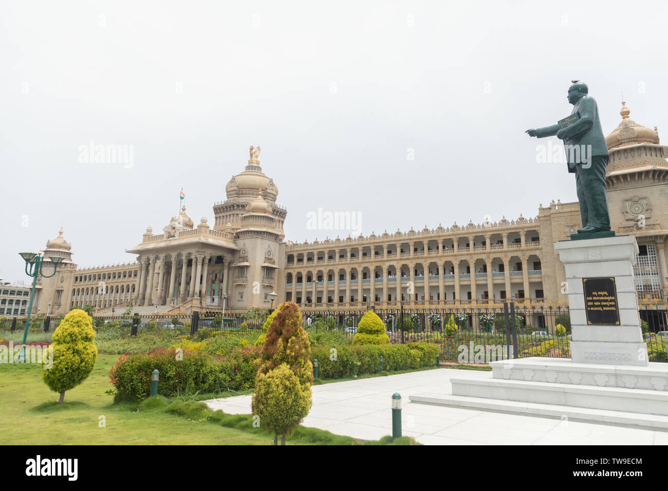 Bangalore, India - June 2, 2019 : Statue of Dr. B.R. Bhimrao Ambedkar holding Indian constitution Pointing towards Parliament of Karnataka in Bangalor Stock Photo