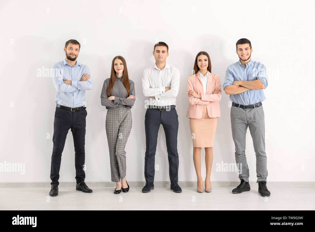 Young people against white wall. Unity concept Stock Photo - Alamy