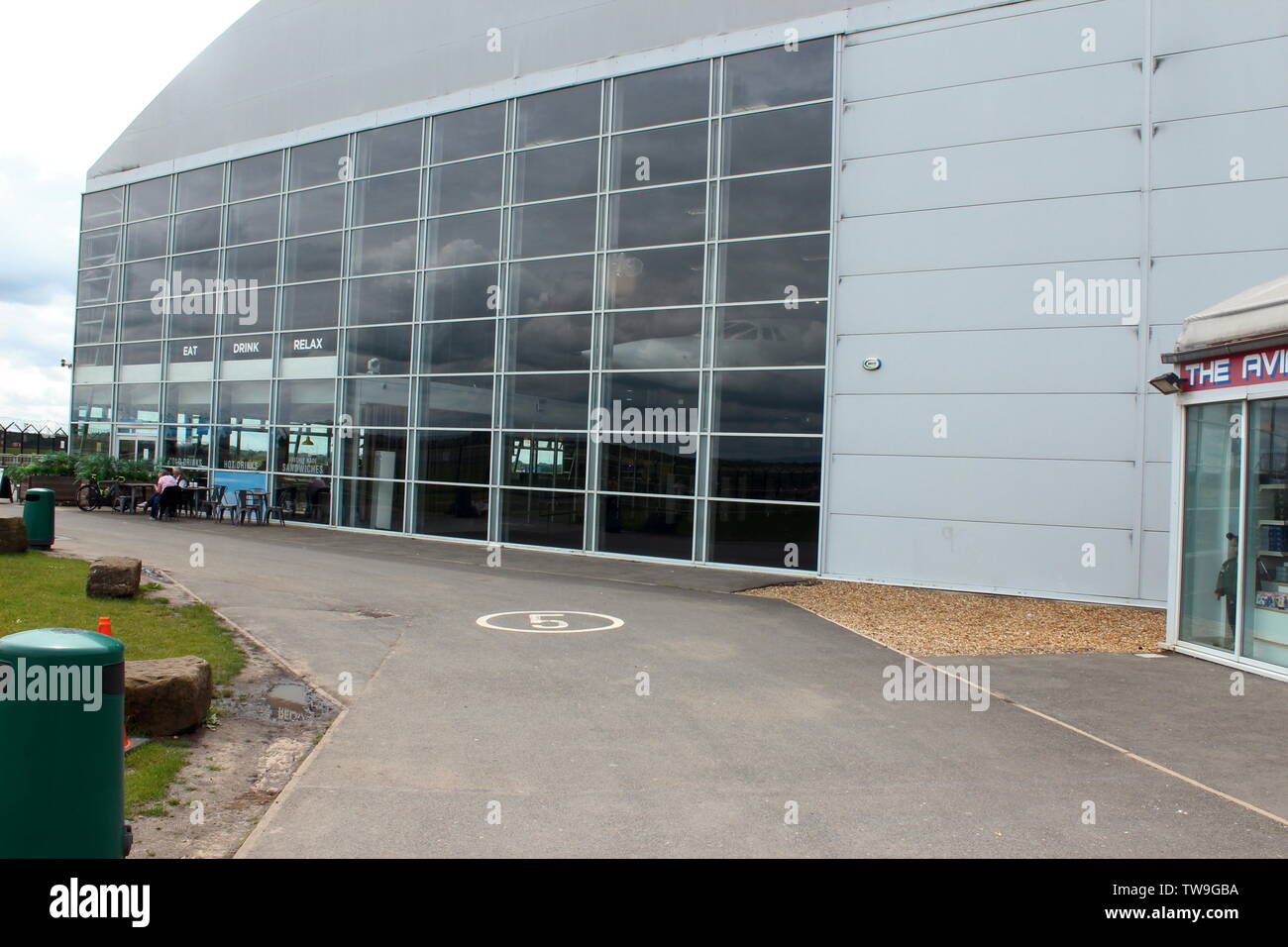 Families visiting Manchester airport's runway visitor park watching the ...