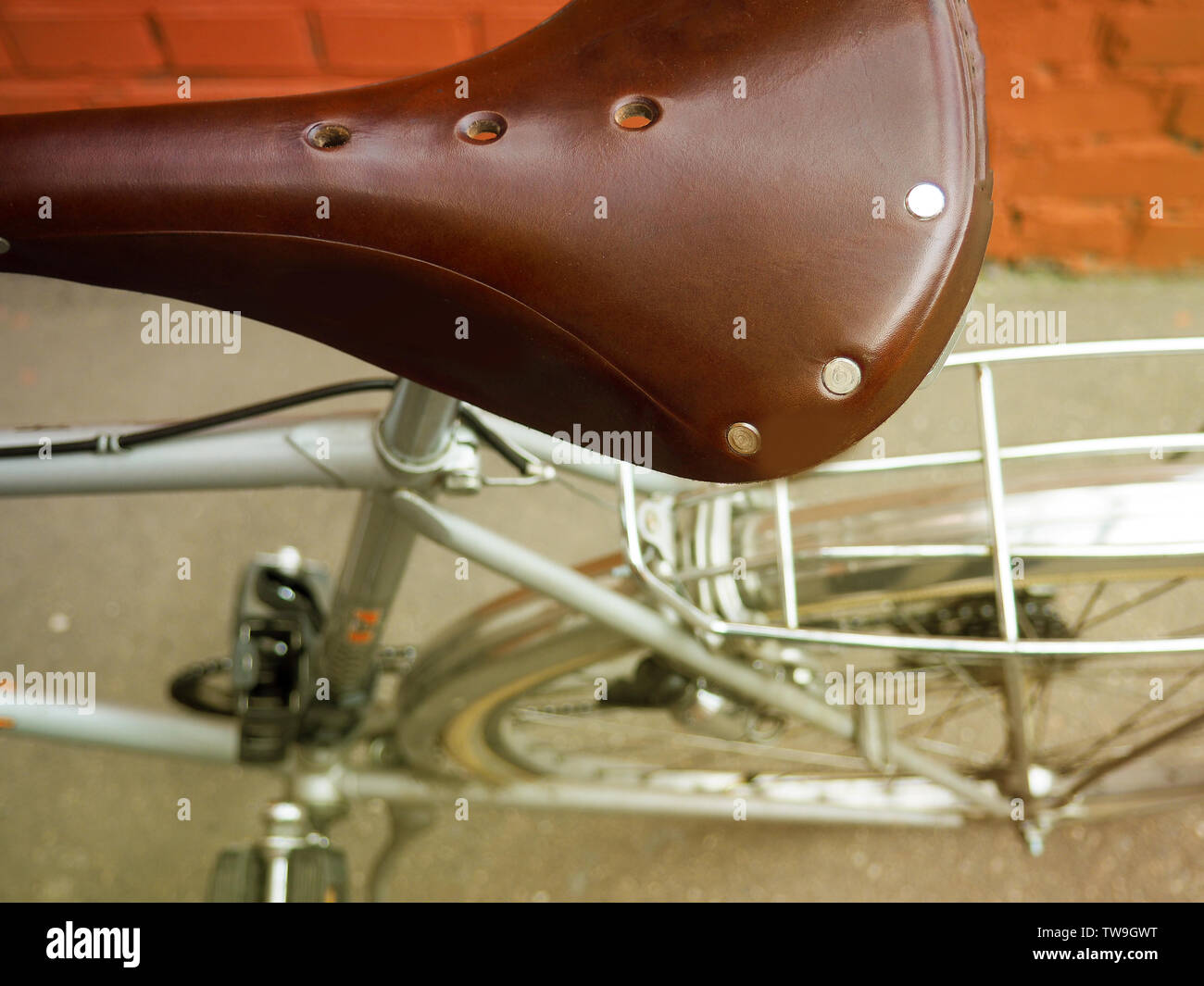 Brown leather saddle of bicycle from top view Stock Photo Alamy