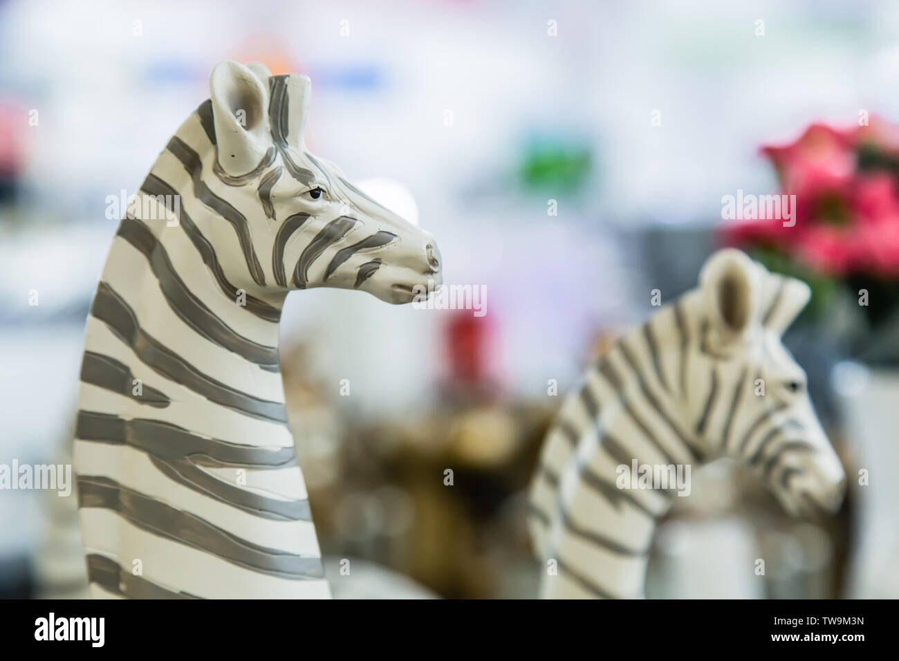 lifelike plastic zebra sculpture toy on display Stock Photo Alamy