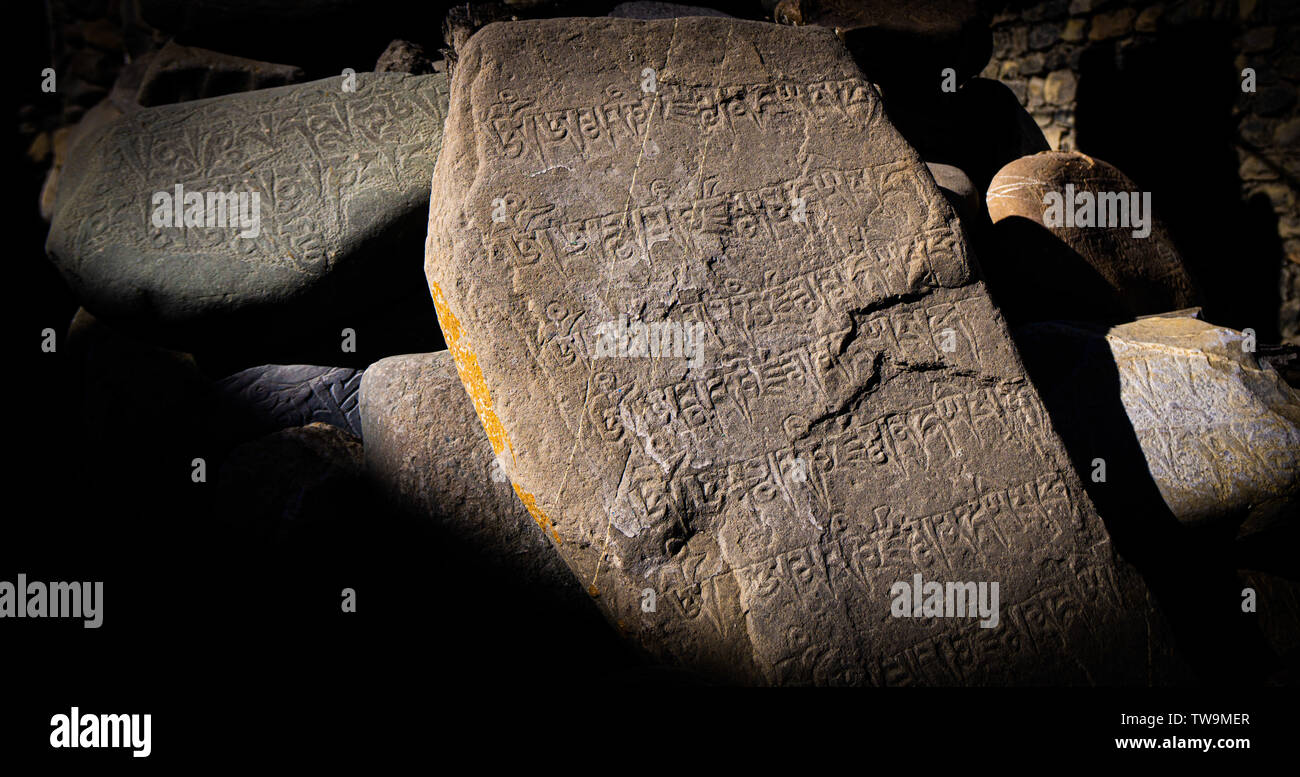 Ancient stones bearing inscriptions, Kagbeni, Upper Mustang, Nepal Stock Photo
