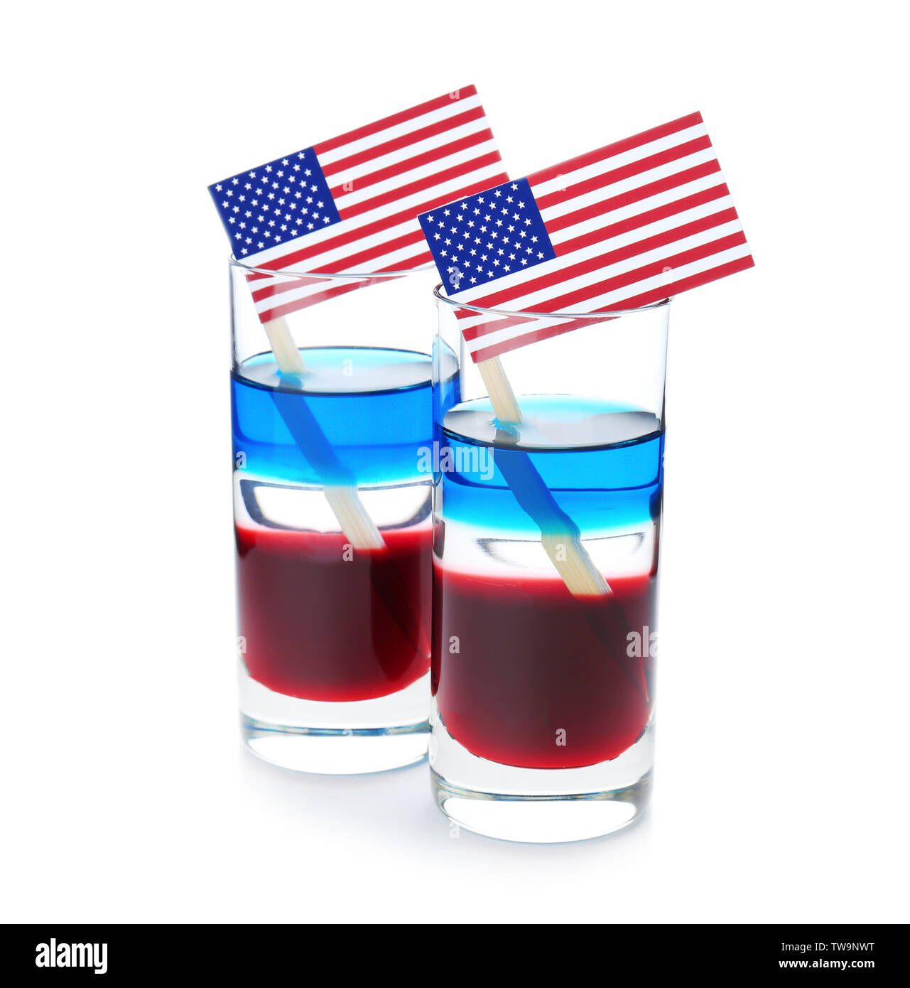Layered cocktails in colors of American flag on white background Stock