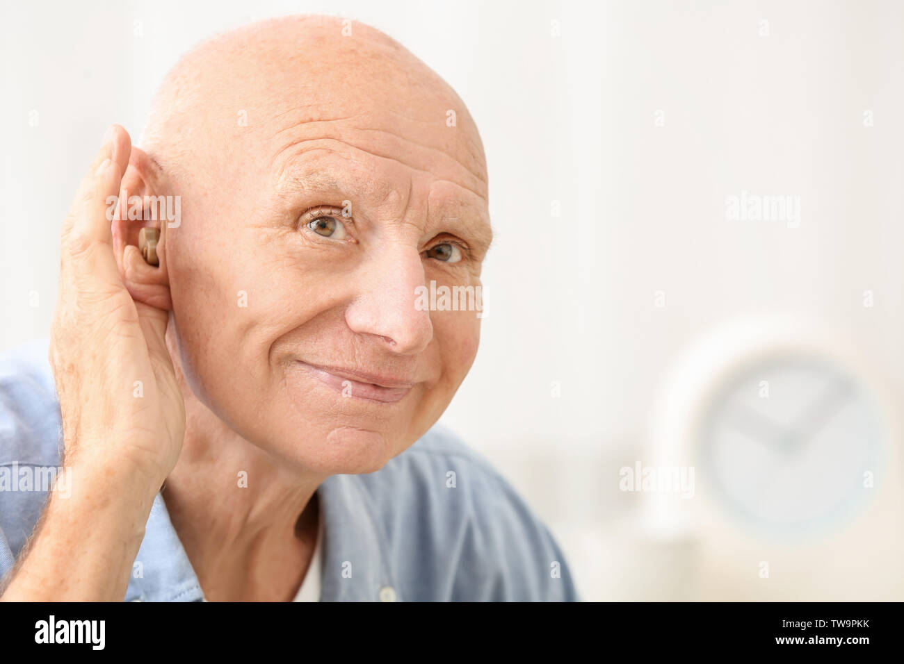 Hearing Impaired Man At Home Stock Photo Alamy