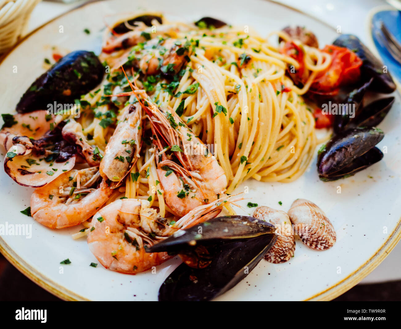 Spaghetti Allo Scoglio Or Spaghetti With Seafood Served In A White Dish With Shrimps And Other Shells Stock Photo Alamy