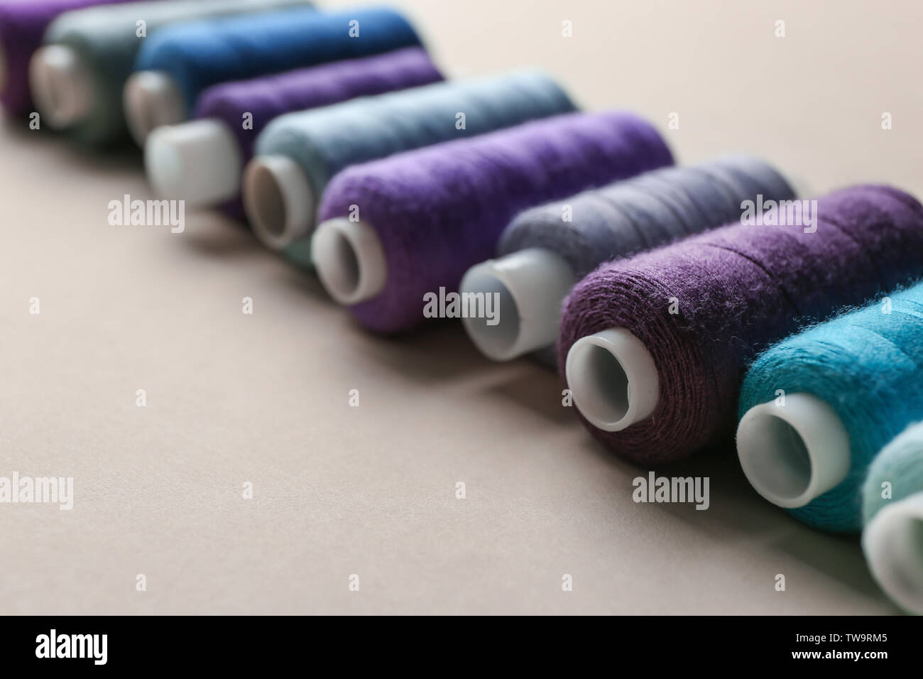 Set of sewing threads on light background Stock Photo - Alamy