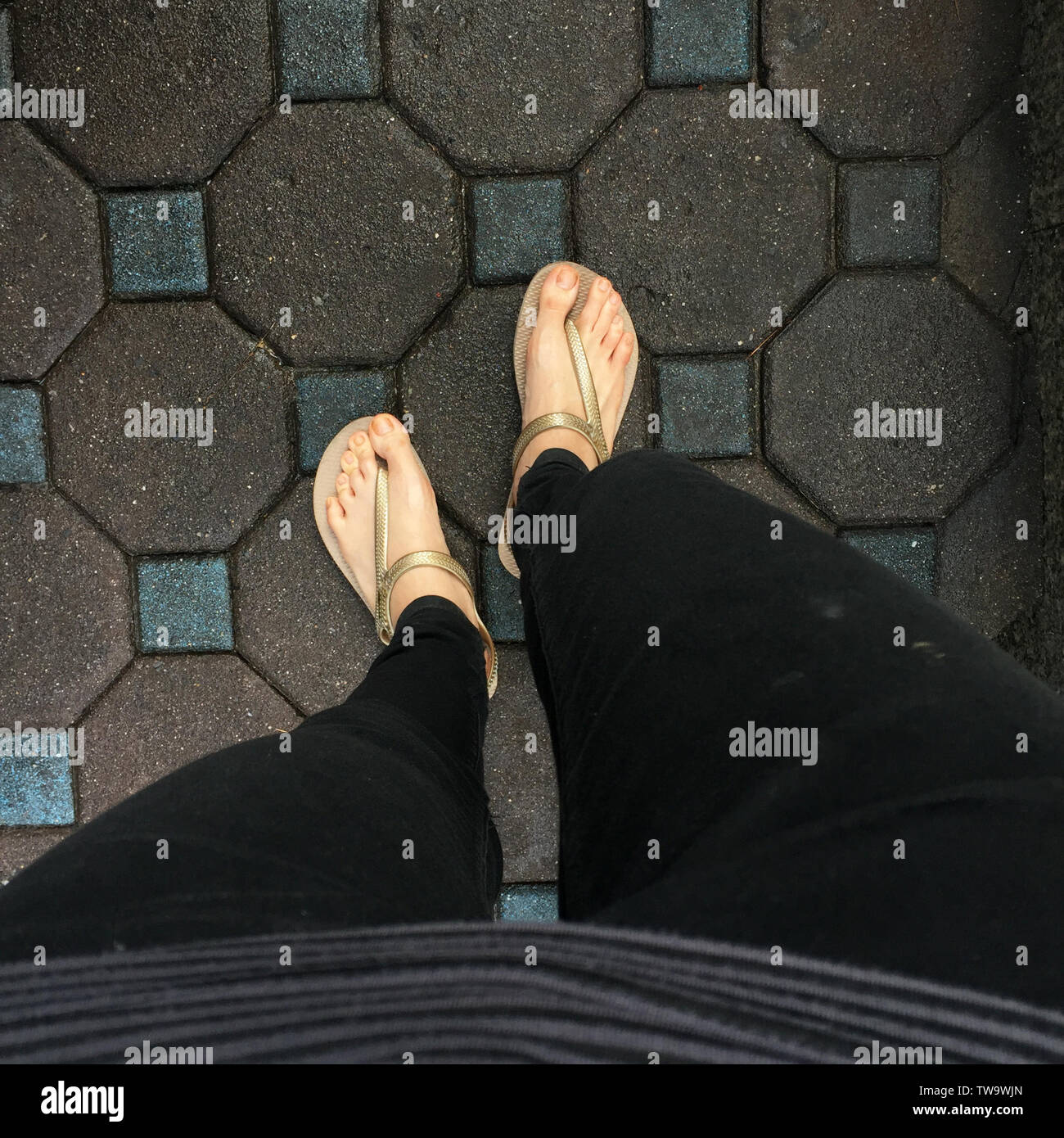 Selfie of feet in sandals shoes on tile background Stock Photo - Alamy