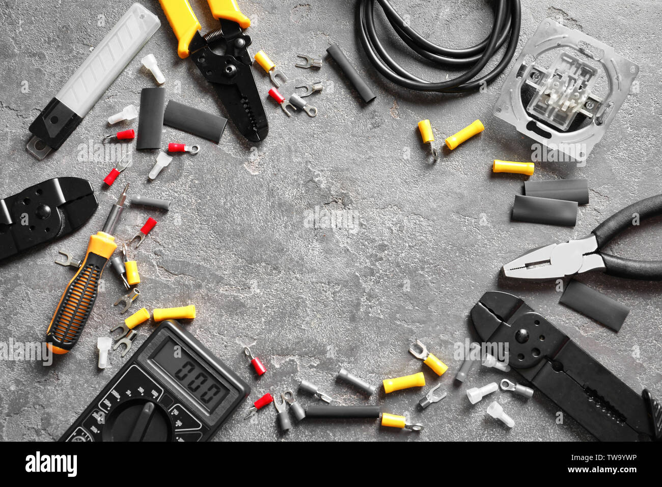 Different electrical tools on grey background Stock Photo