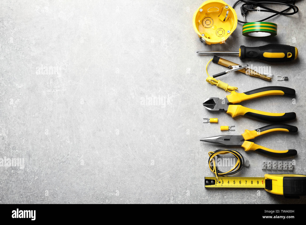 Different electrical tools on grey background Stock Photo
