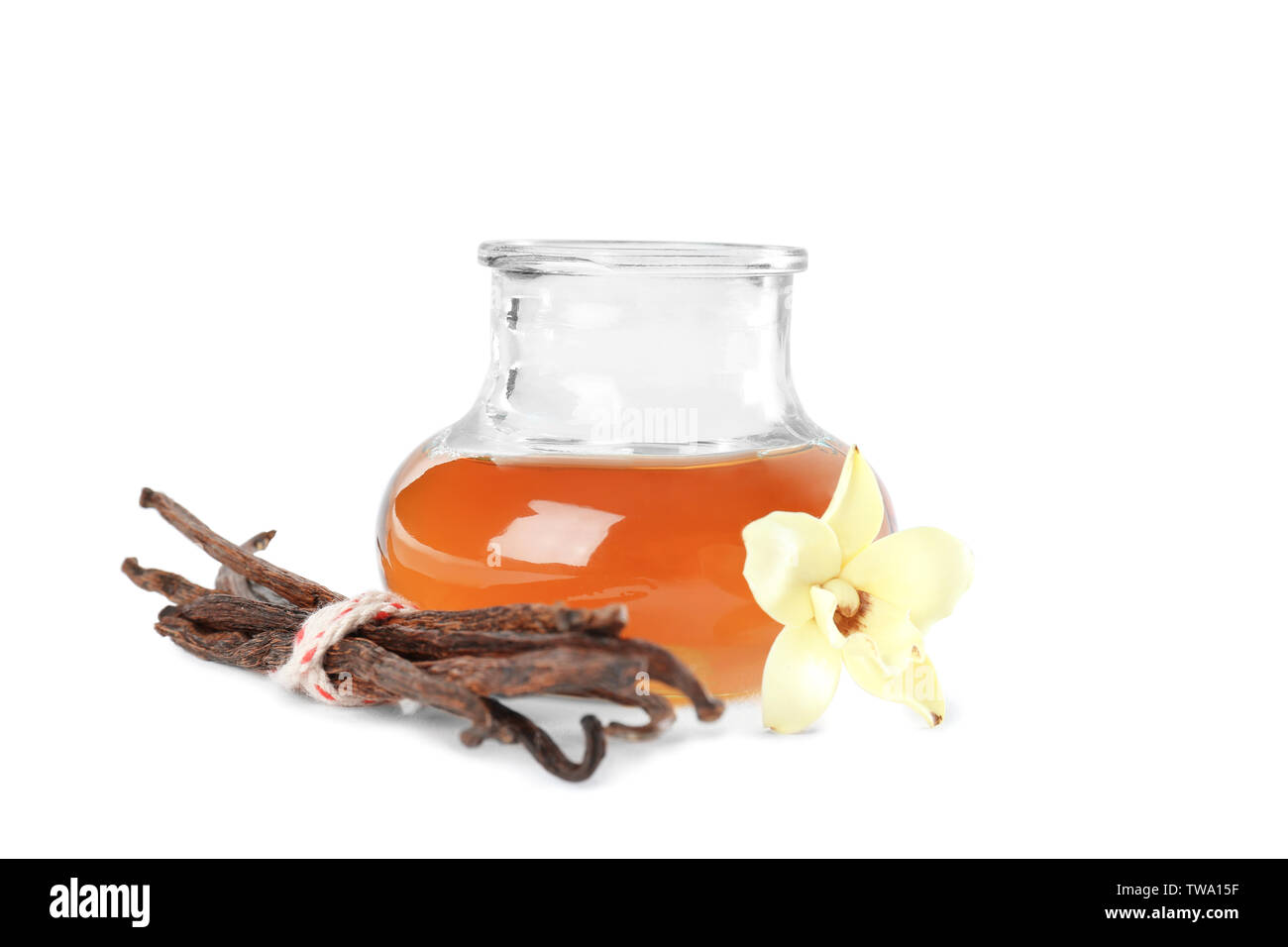 Glass jar with vanilla extract on white background Stock Photo Alamy