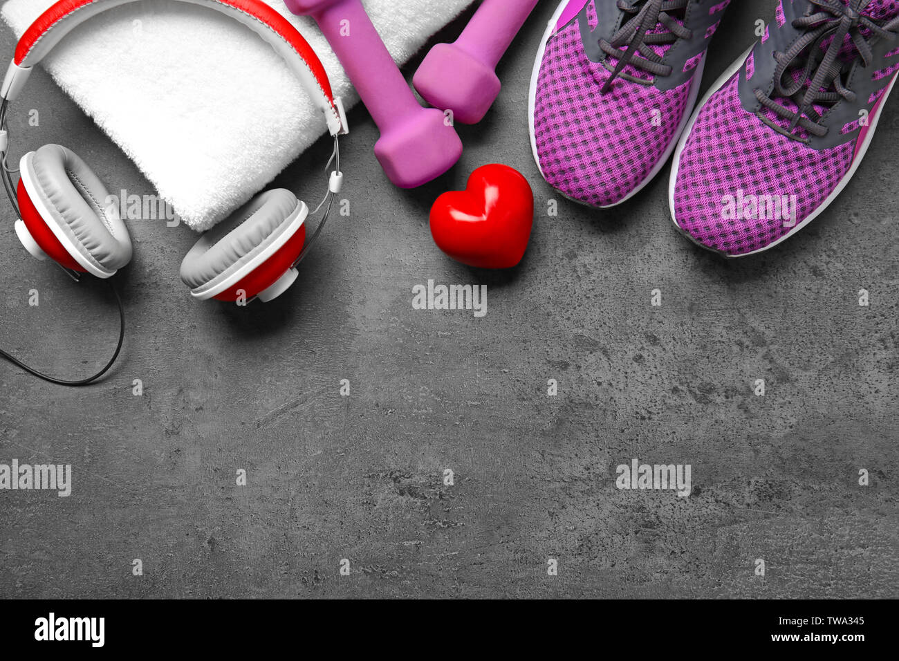 Gym stuff and red heart on grey background. Cardio training concept Stock Photo Alamy