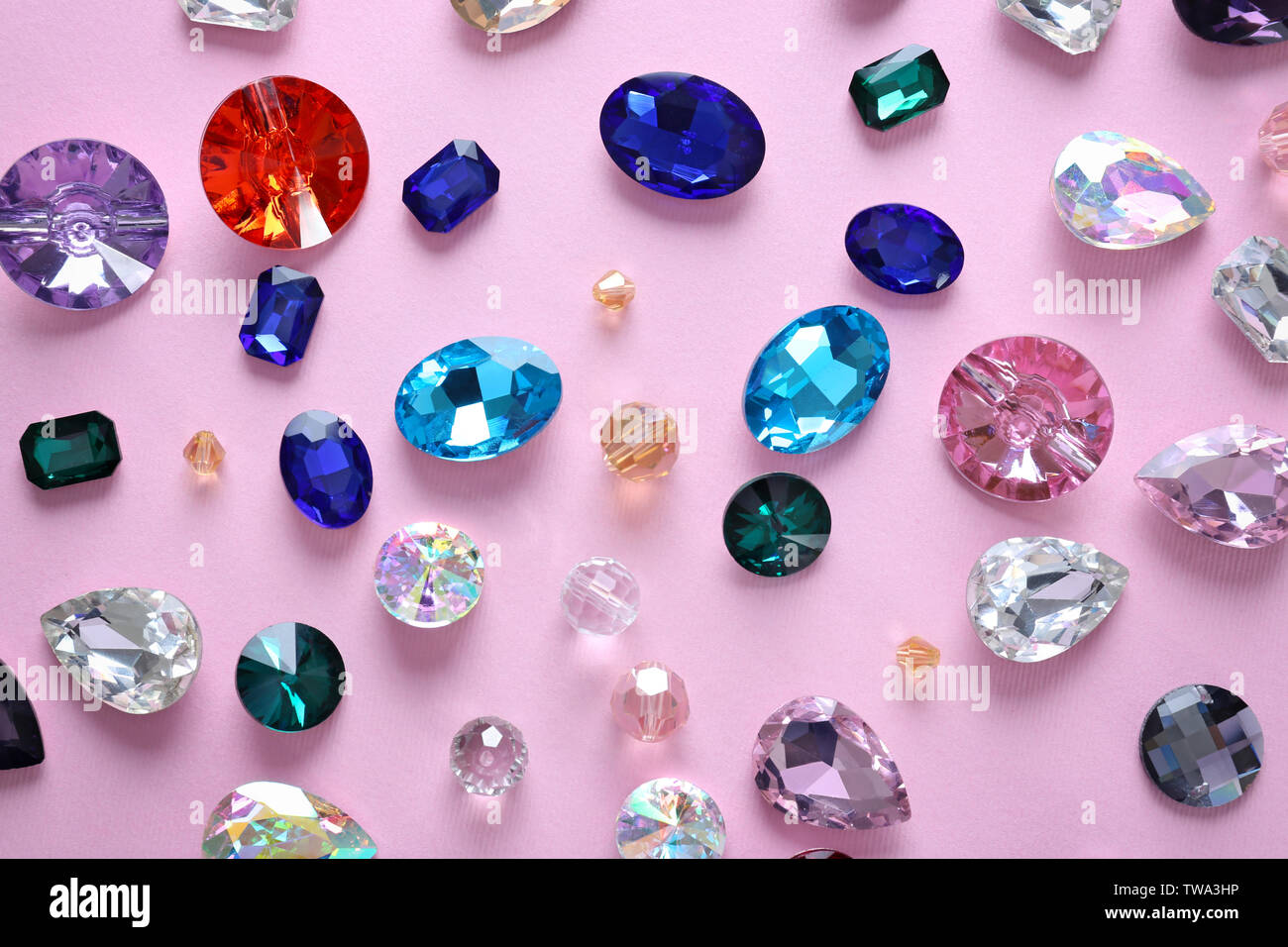 Different precious stones for jewellery on color background Stock Photo