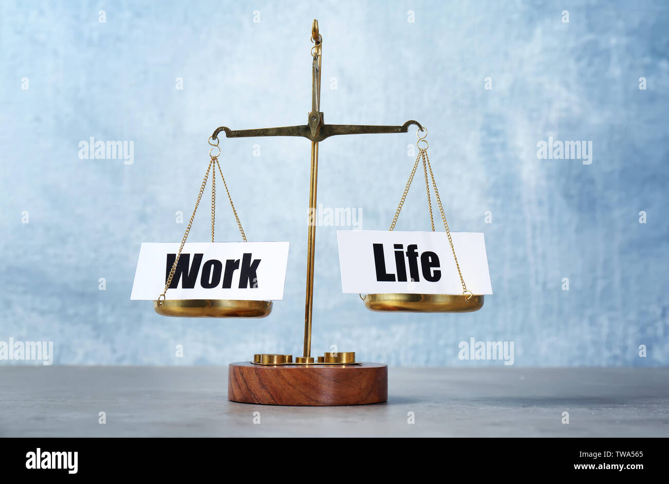 Scales with words WORK and LIFE on table Stock Photo - Alamy