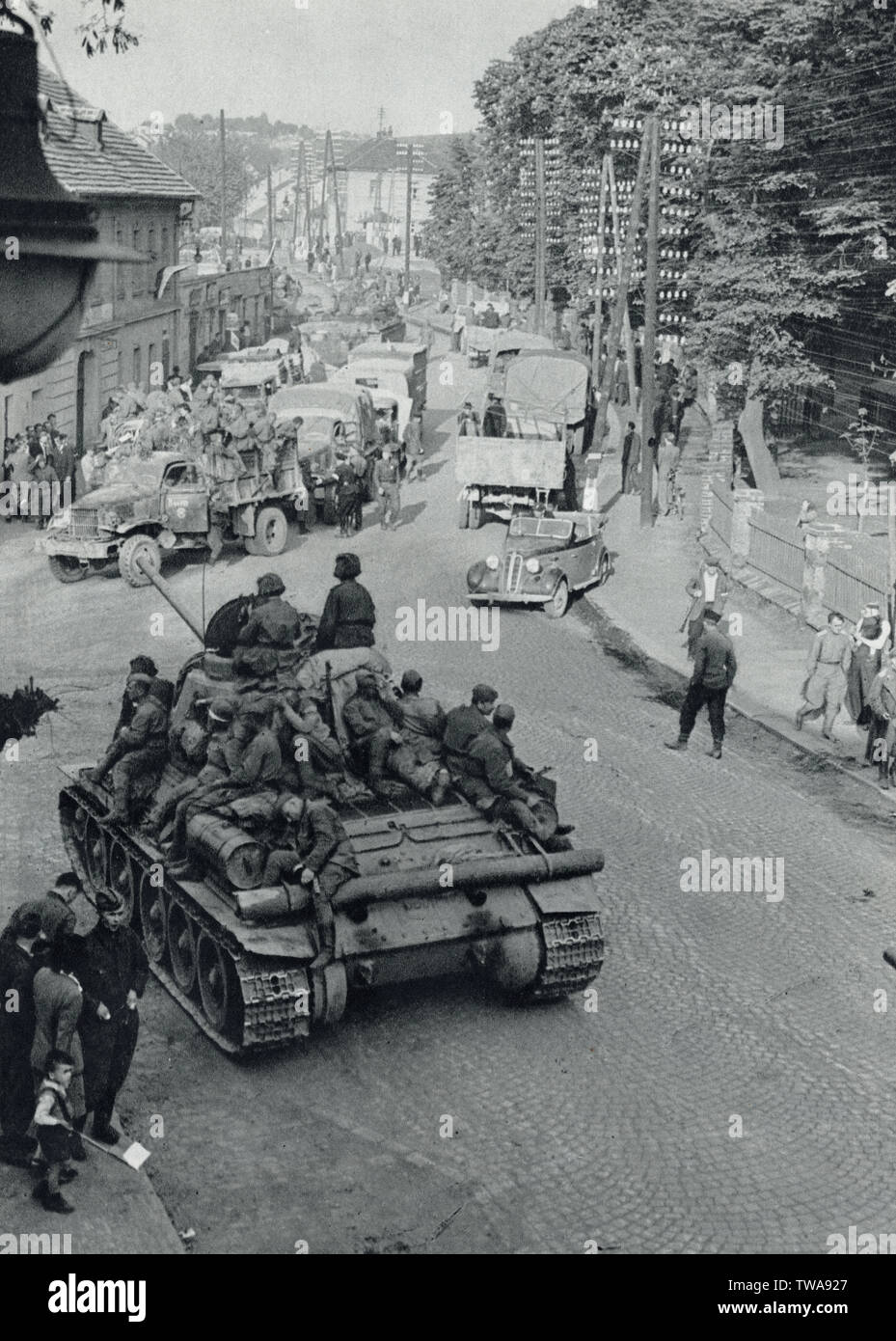 Red Army tank T-34 in Hrdlořezy district in Prague, Czechoslovakia, in May 1945. Black and white photograph by Czech photographer A. Řimal published in the Czechoslovak book 'For the Eternal Times' ('Na věčné časy') issued in 1959. Courtesy of the Azoor Photo Collection. Stock Photo