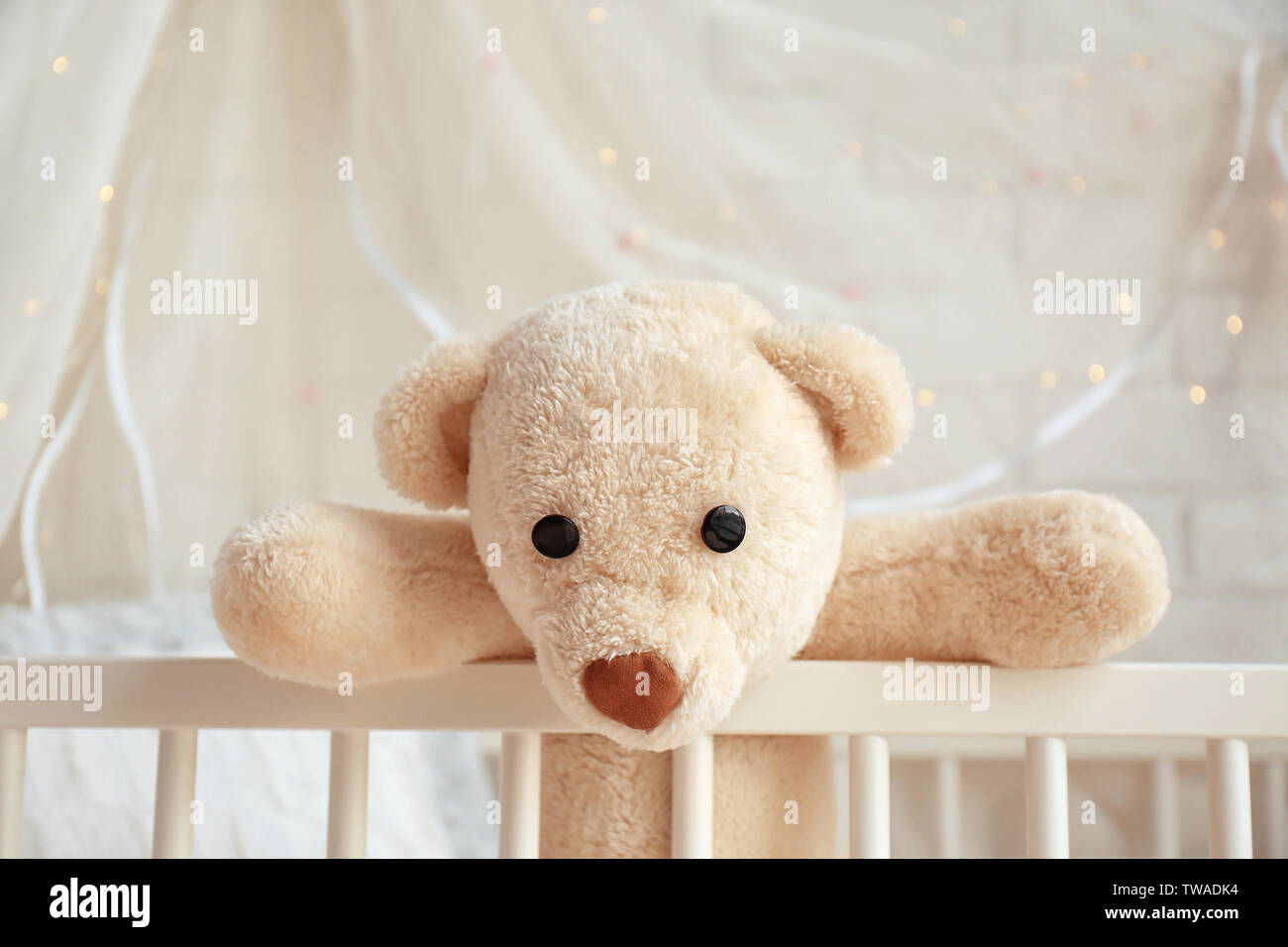 Child in cot with teddy bear hi-res stock photography and images - Alamy