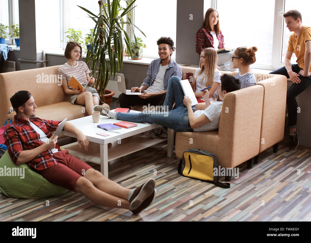 Students resting together in campus building Stock Photo