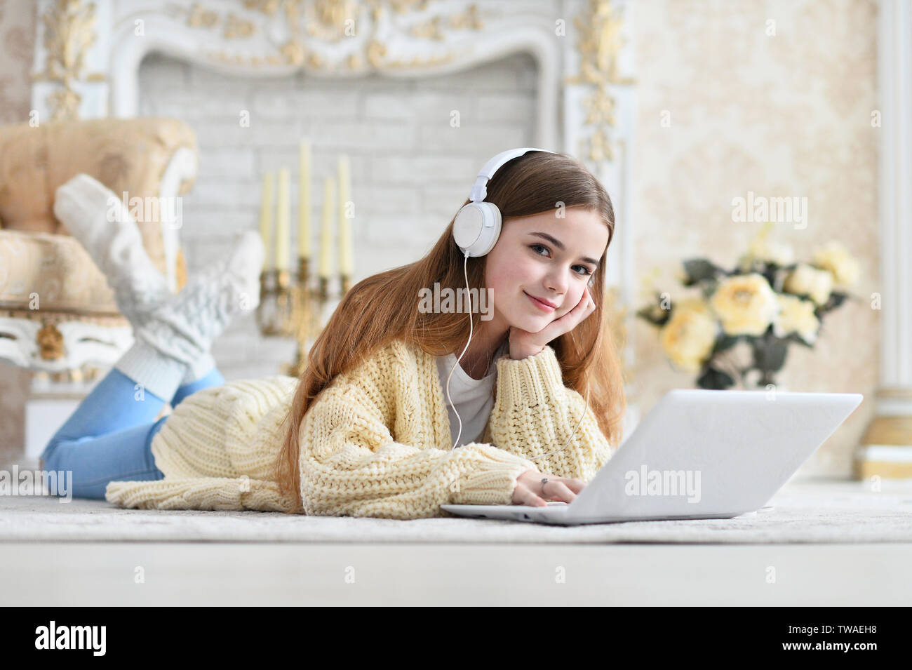Portrait of beautiful teen girl lying on floor Stock Photo - Alamy