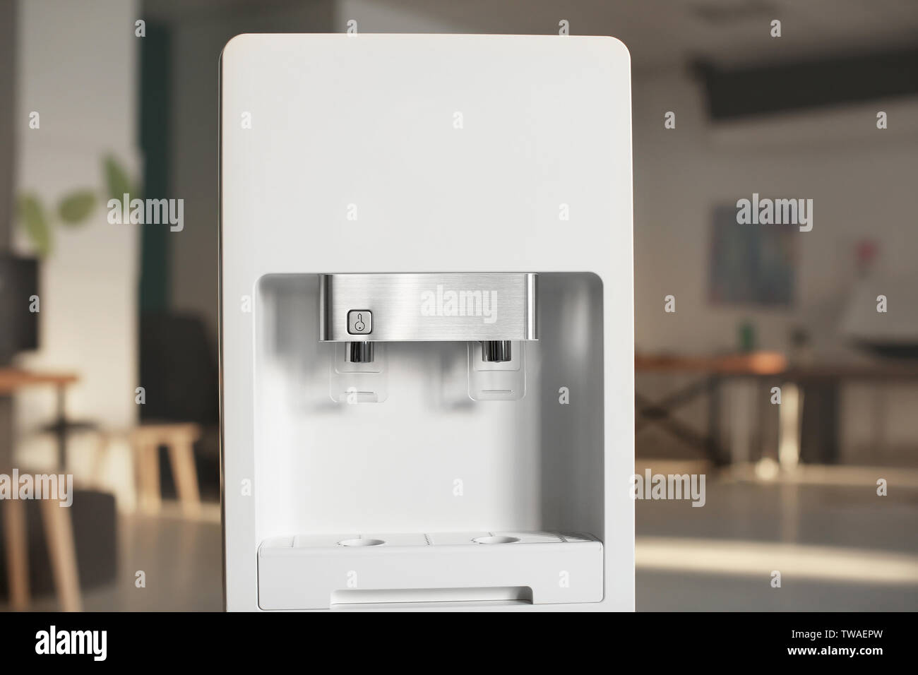 Modern water cooler in office Stock Photo Alamy