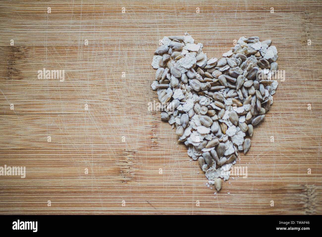 grains and oats on a wooden board Stock Photo