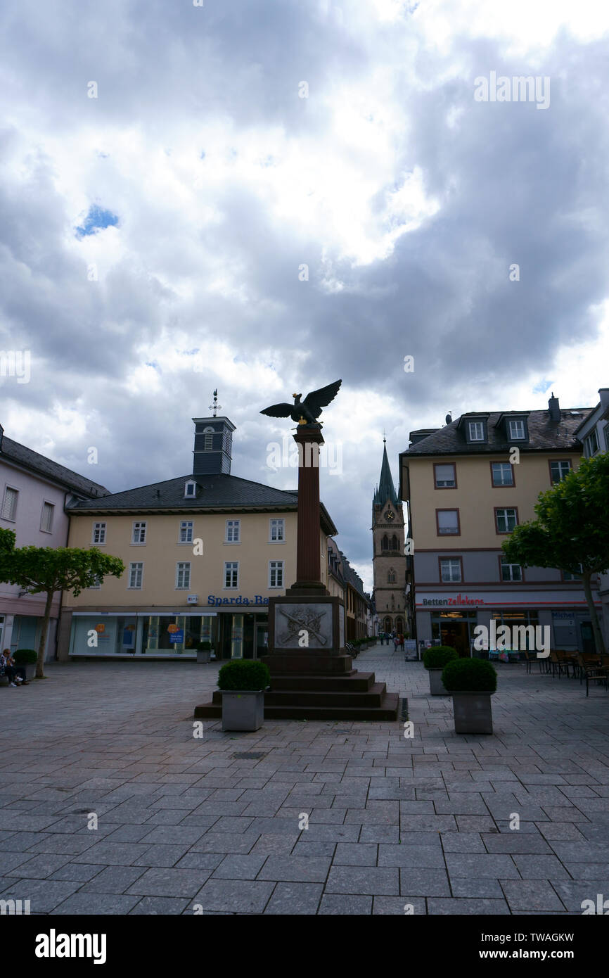 Bad Homburg, Germany - June 09, 2019: The war memorial on the Waisenhausplatz with adjoining shops on June 09, 2019 in Bad Homburg. Stock Photo