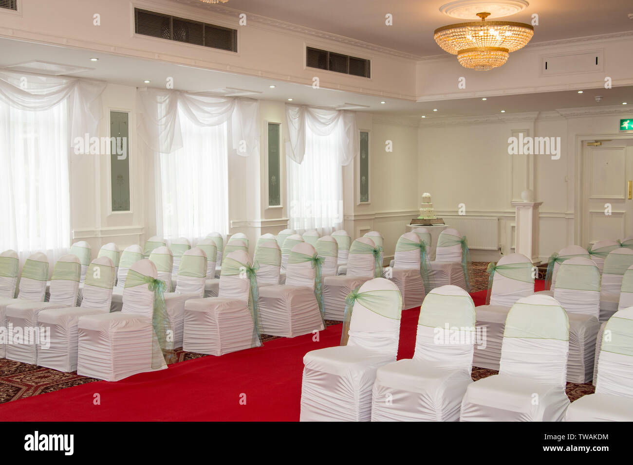 Rows of empty chairs with covers in a UK venue for a Wedding Reception Stock Photo