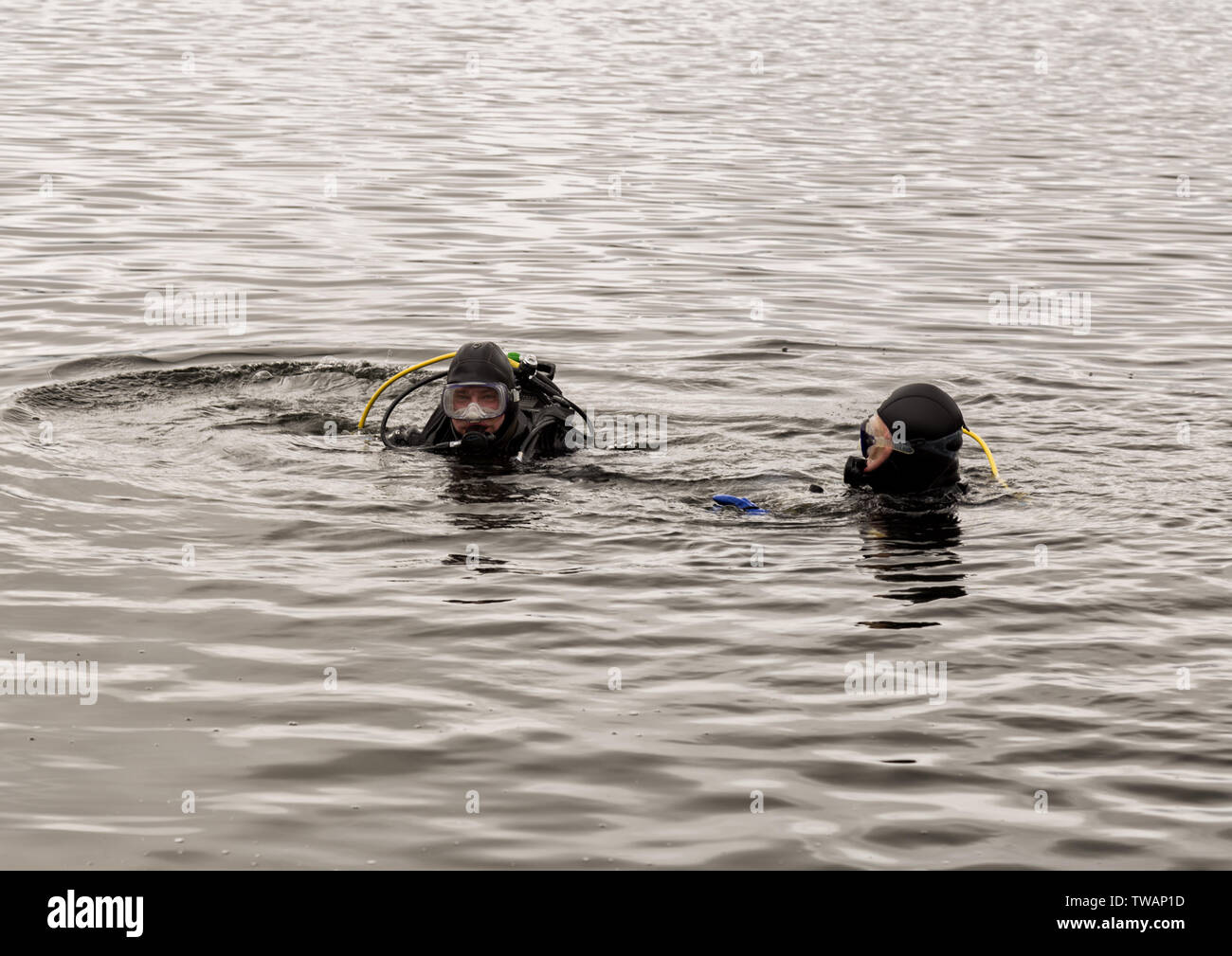scuba diving in a mountain lake, practicing techniques for emergency
