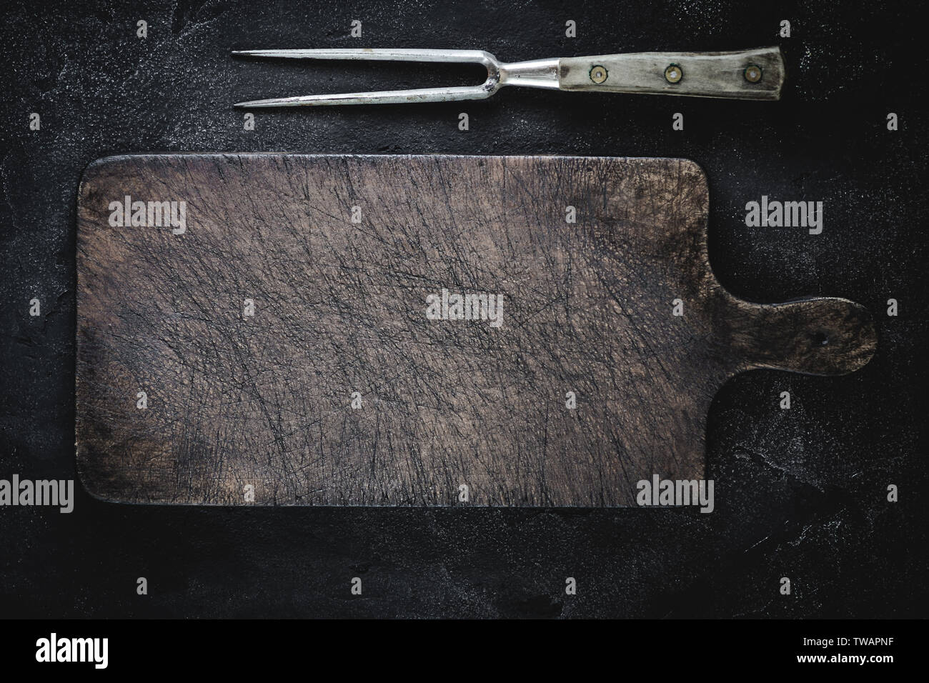 Empty Vintage Brown Chopping Board with Old Fork for Restaurant Menu Stock Photo