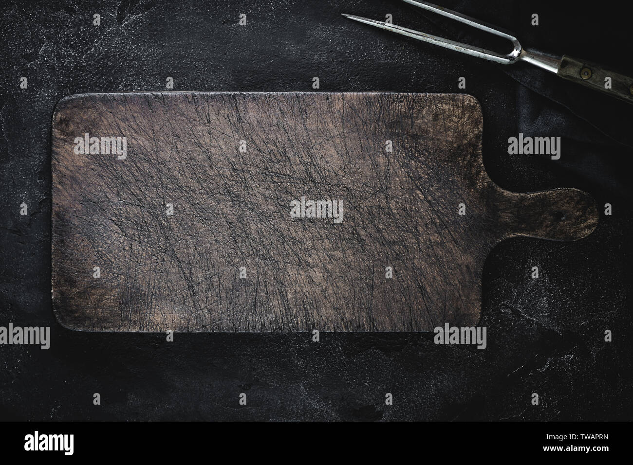 Empty Vintage Brown Chopping Board with Old Fork for Restaurant Menu Stock Photo