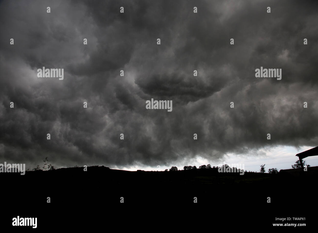 Dark rain clouds from Storm Miguel looming over Meon Hill near Mickleton, Chipping Campden, UK Stock Photo