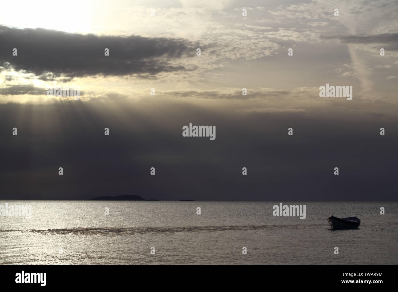 Sunset in the sea with a boat. A picture of a small boat with a ...