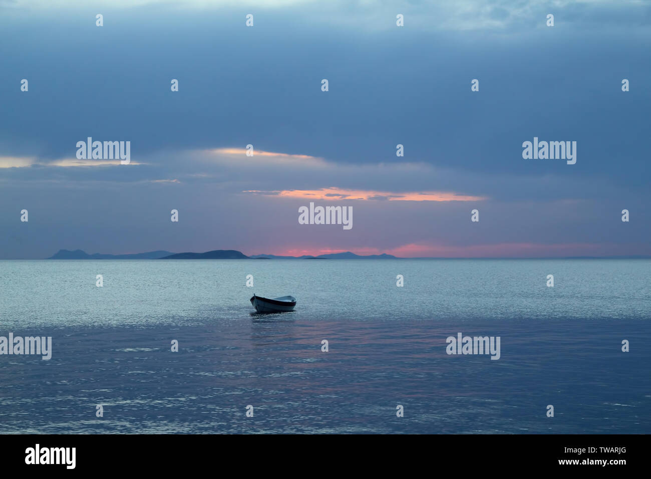 Sunset in the sea with a boat. A picture of a small boat with a ...