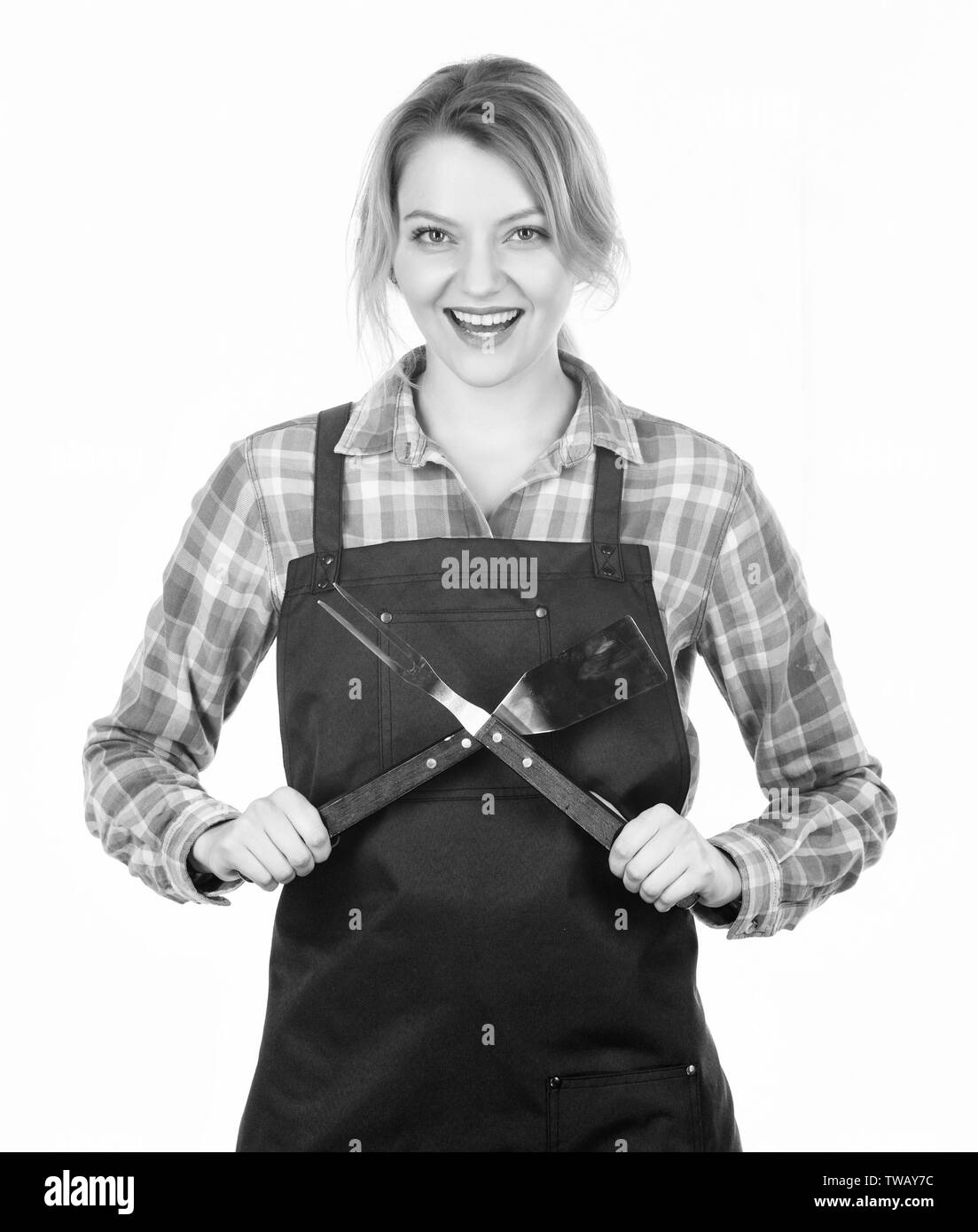 housewife in good mood. food cooking recipe. Picnic barbecue. Pretty girl in chef apron. Tools for cook. Woman hold kitchen utensils. Preparation and culinary. Family weekend. Stock Photo
