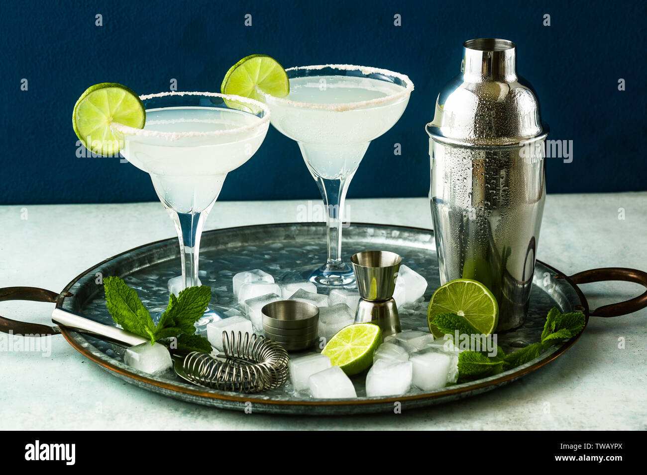 classic margarita cocktail on the table with bar accessories Stock