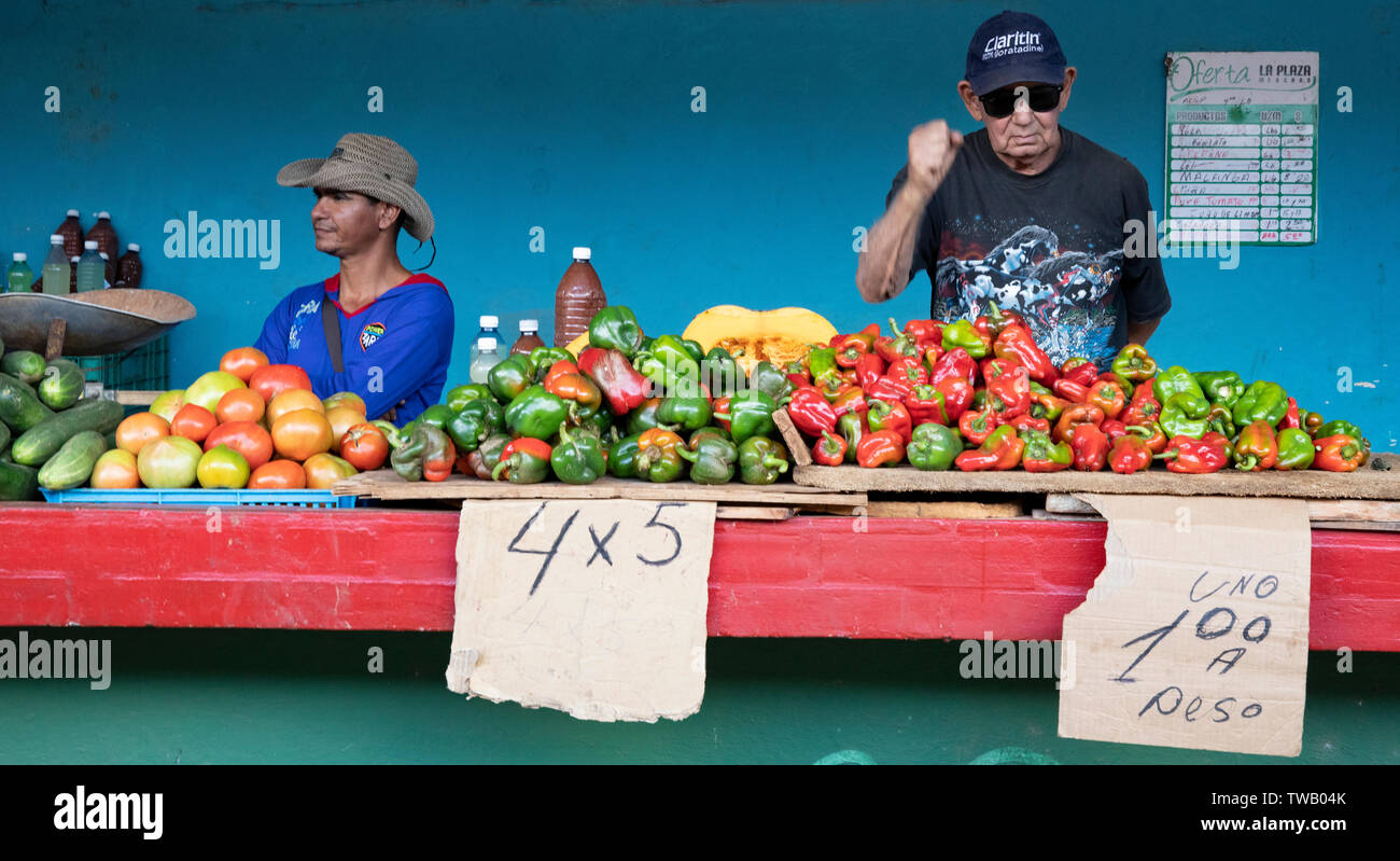Vegetable sellers at their stall in Sancti Spiritus market, Cuba. Stock Photo