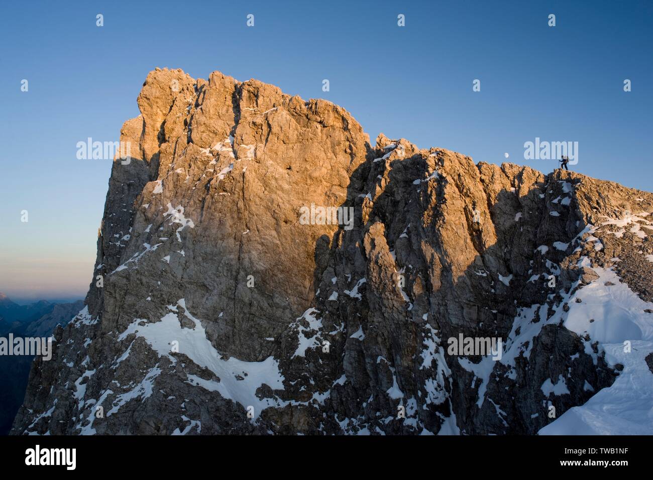 Austria, Tyrol, Karwendel Mountains, mountaineers at summit ridge of the Laliderer. Stock Photo