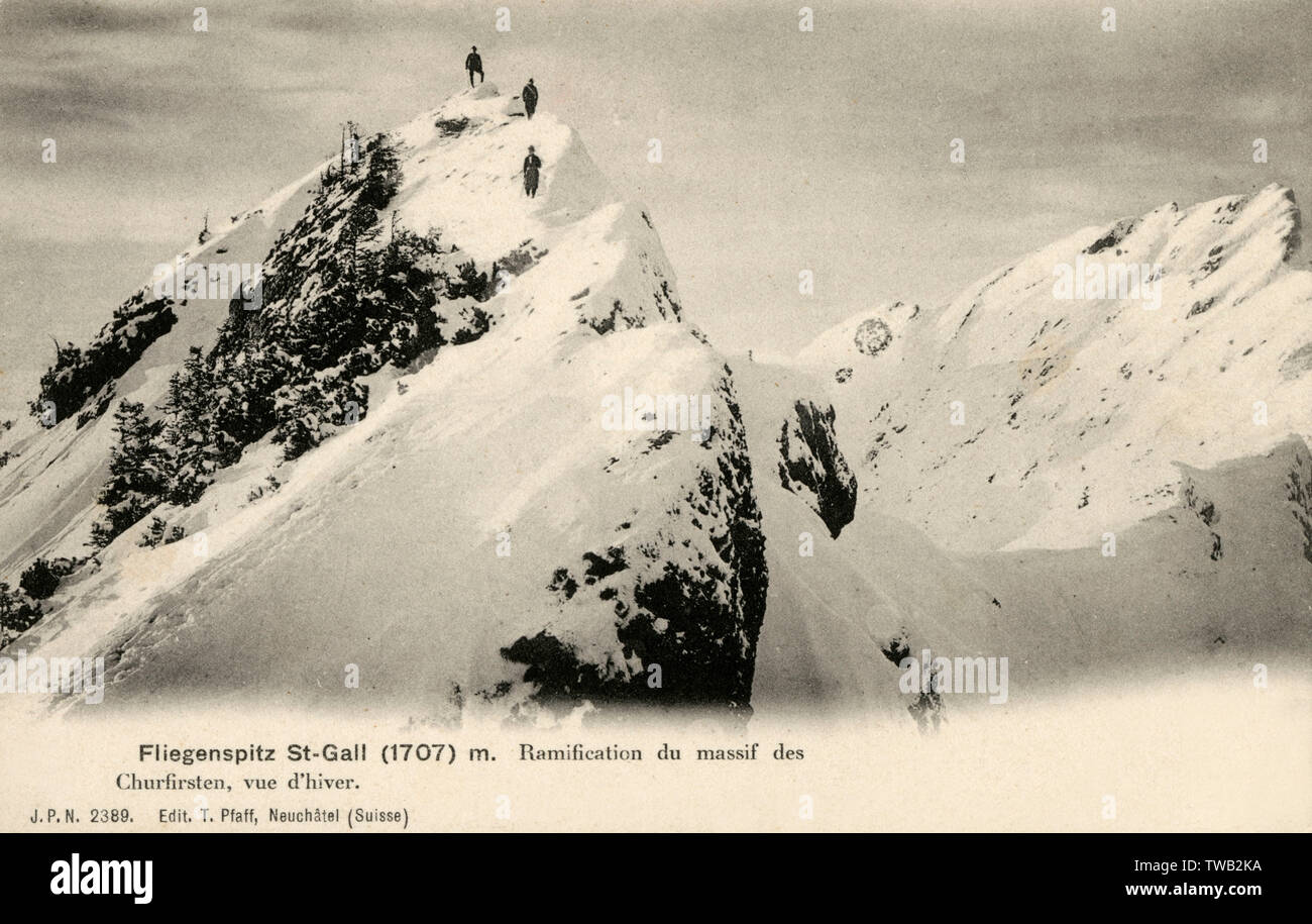Climbers at the peak of a mountain in the Churfirsten range Stock Photo